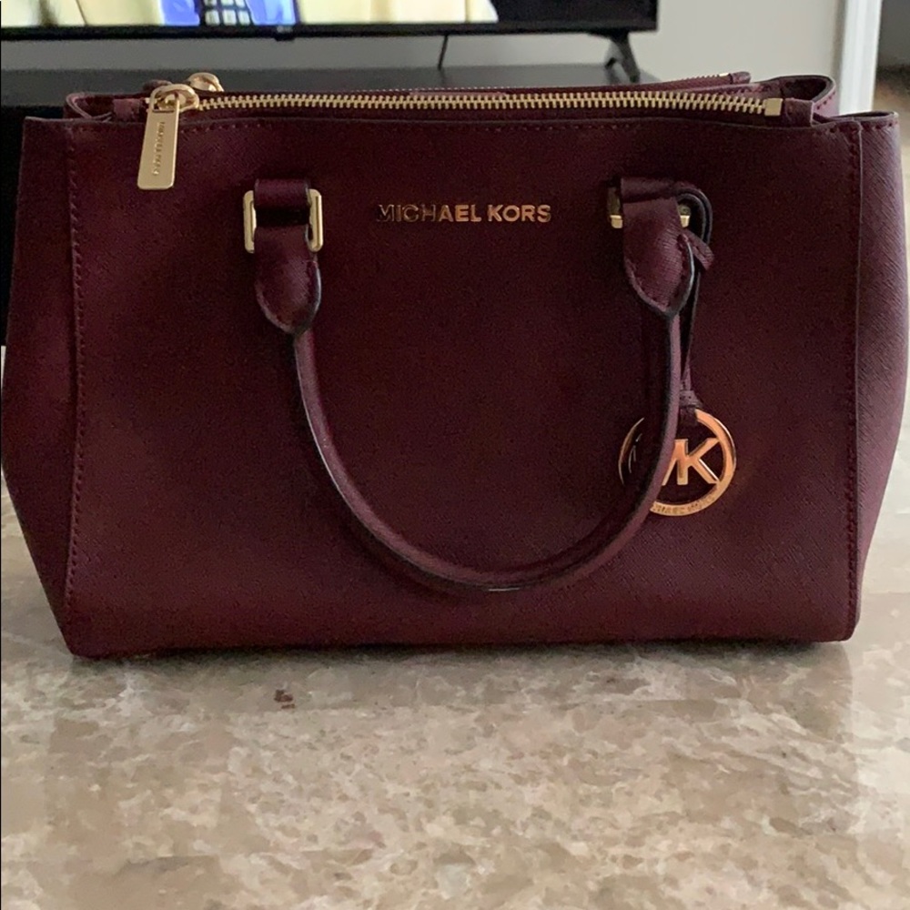 Michael Kors berry(burgundy) color purse.